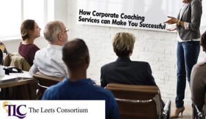 corporate coach in front of executives